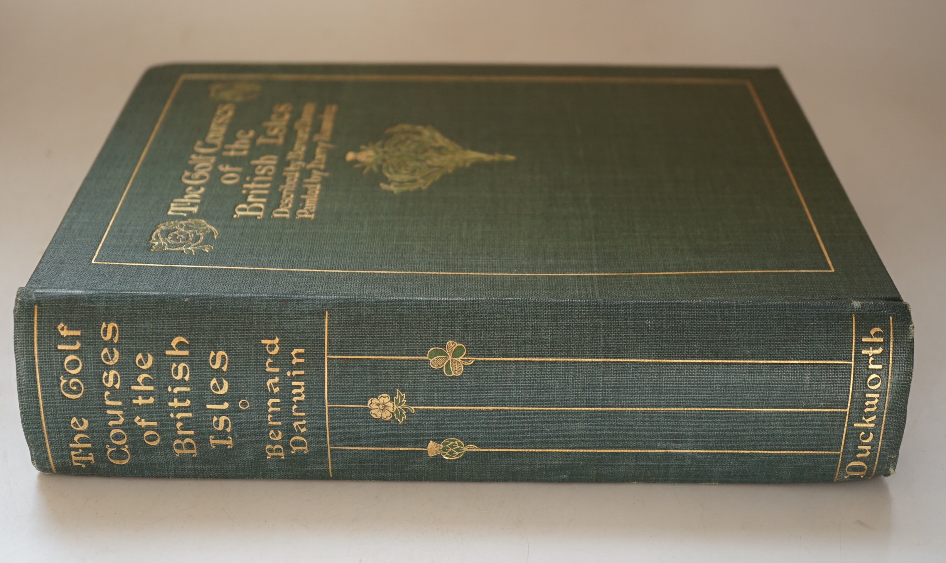 Darwin, Bernard - The Golf Courses of the British Isles, 1st edition, illustrated by Harry Rountree, with colour frontispiece and 44 colour plates, 4to, publisher's green pictorial cloth, some spotting, Duckworth, London